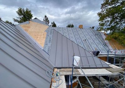 Interior Roofing Metal roof placing panels during install