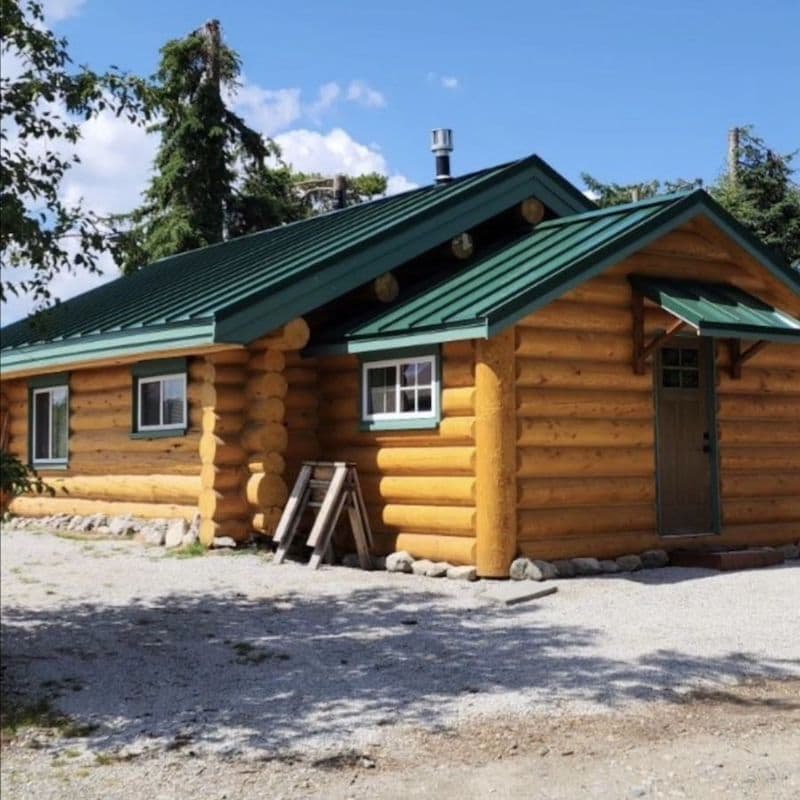 Interior-Roofing-log-home-with-green-metal-roof